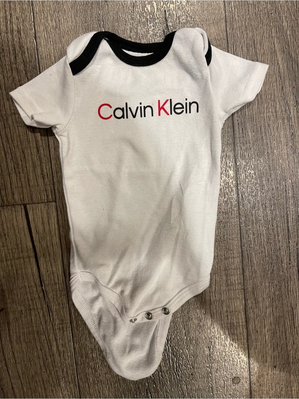 Calvin Klein White Baby One-Piece with Black Trim and Red Logo